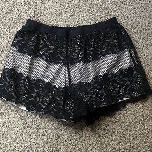 Trendy BEBE Pull On Elastic Black Lace Shorts, L